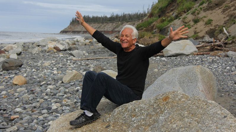 Senior Enjoying a Rocky Beach