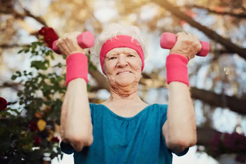 Senior Woman with Pink Dumbbells