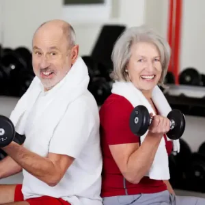 Two Seniors Lifting Weights