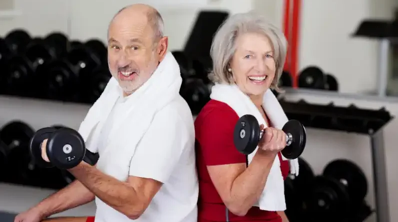 Two Seniors Lifting Weights